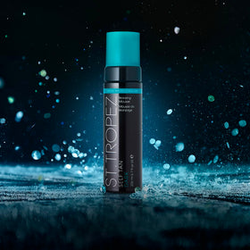 St.Tropez mousse texture close-up highlighting lightweight, quick-drying formula benefit