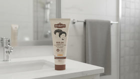 Sta-Sof-Fro in use by woman applying to scalp, convenient targeted hydration benefit