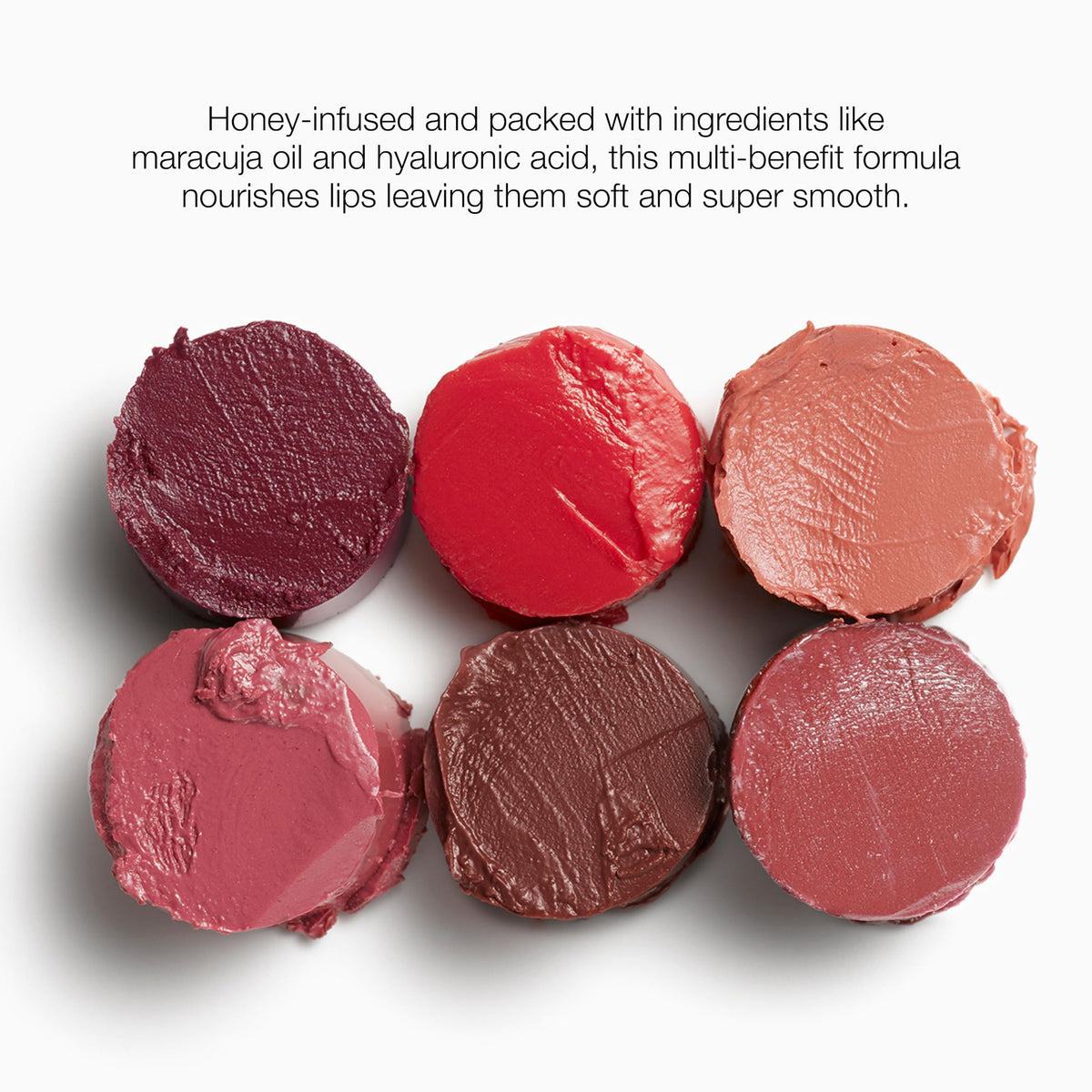 stila balm beside a coin to show compact size for handbag convenience