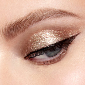 stila mini glitter glow in makeup bag showing portability and spill-resistant cap