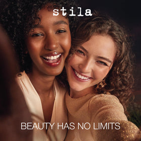 stila pen in hand applying liner to eyelid for precise wing and lash definition