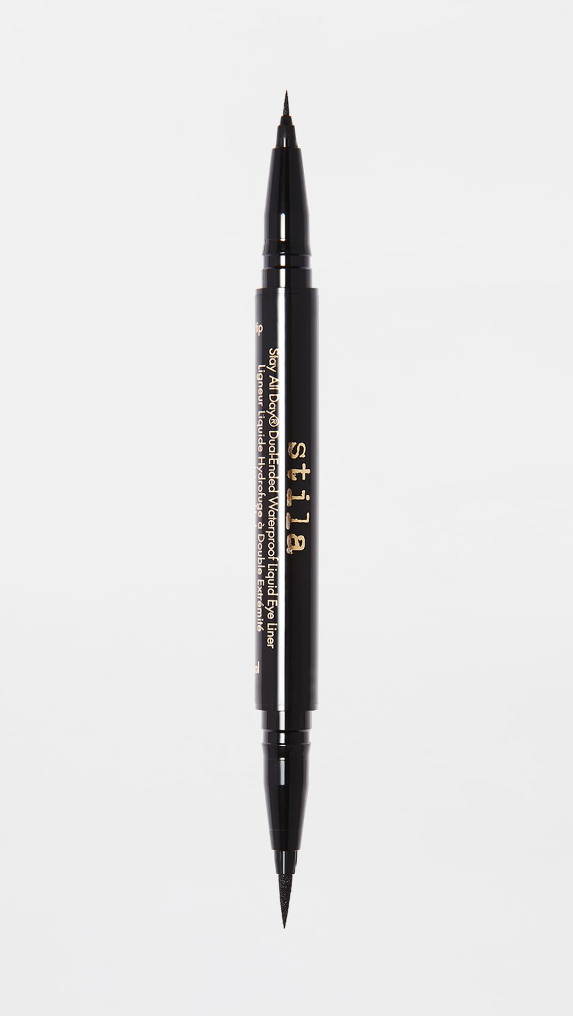 stila eyeliner size comparison next to coin shows compact travel-friendly benefit