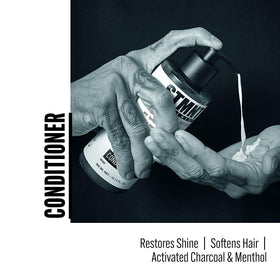 STMNT conditioner close-up label highlighting active charcoal and menthol benefits clearly