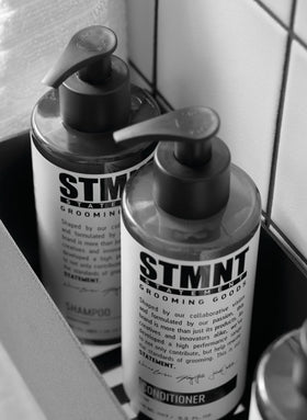STMNT conditioner creamy texture on hand showing moisturizing consistency