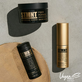 STMNT fiber pomade next to ruler size comparison indicating 3.38 oz portability