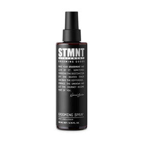 STMNT grooming spray front bottle shows label and sleek design for easy storage