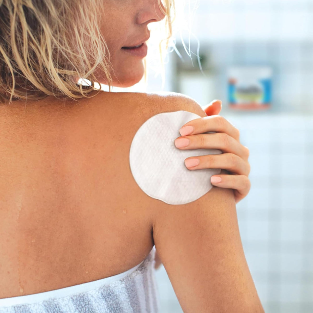 Stridex XL application on cheek showing dual-textured pad reducing surface oil