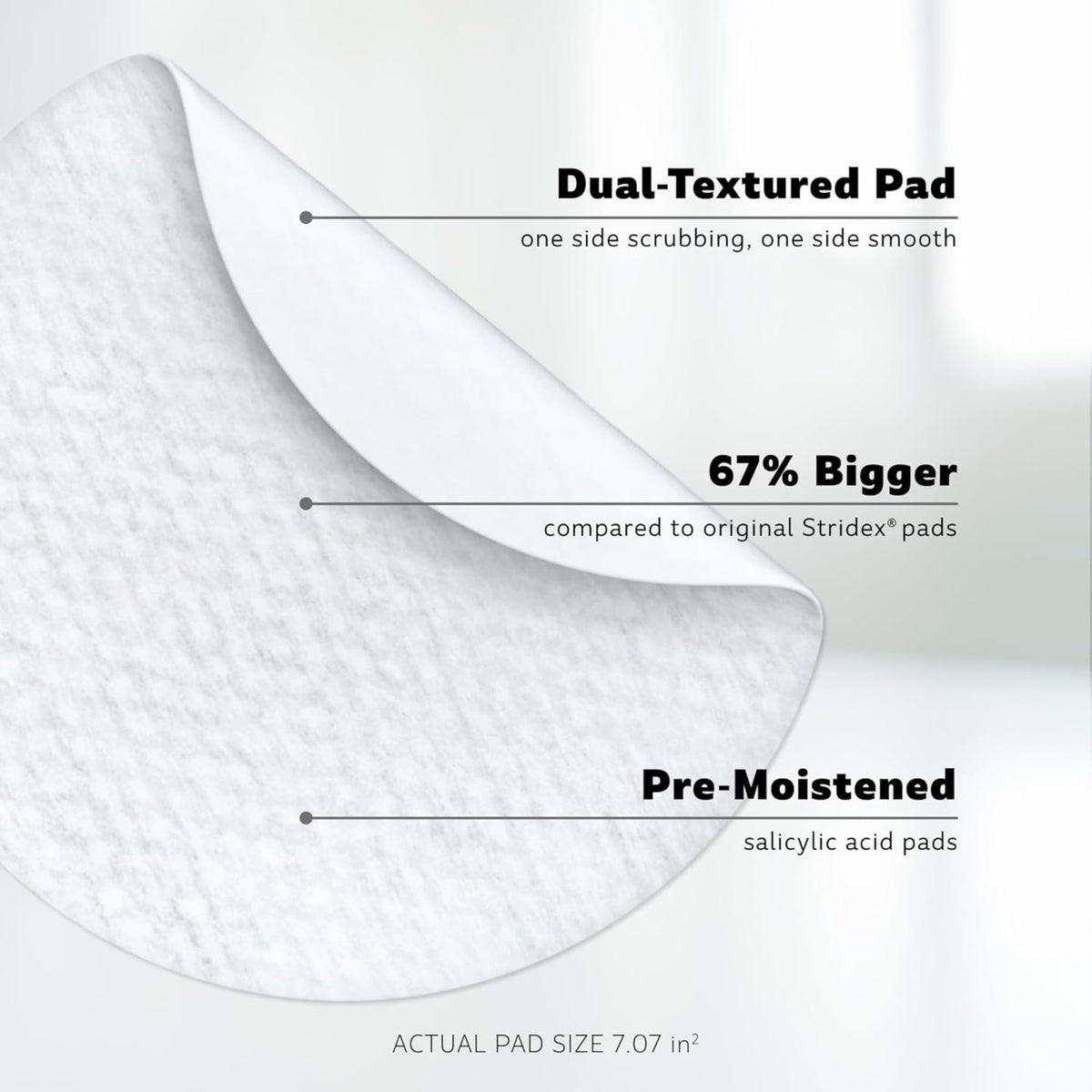 Stridex XL pad in hand demonstrating size and coverage for face and body