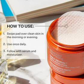 Hand holding StriVectin pad demonstrating easy once-daily application benefit