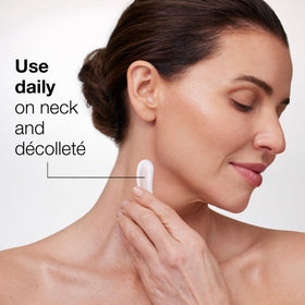 StriVectin product next to hand for size and scale visualization benefit