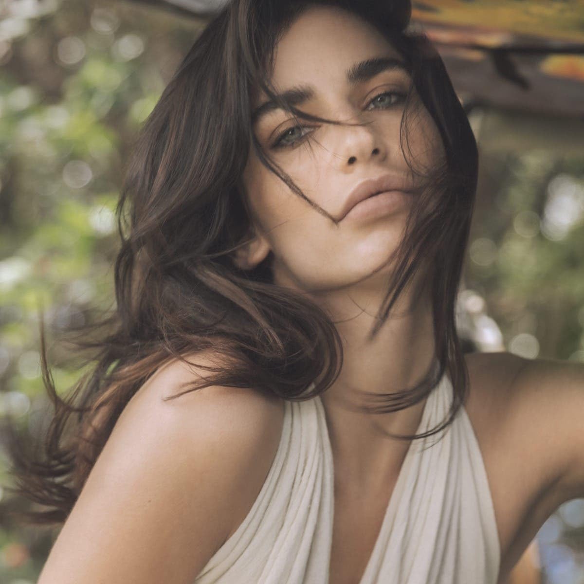 Styling treatment in use during blow-dry demonstrating frizz control and silky finish