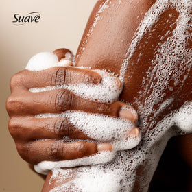Suave bottle positioned in a shower indicating easy everyday use