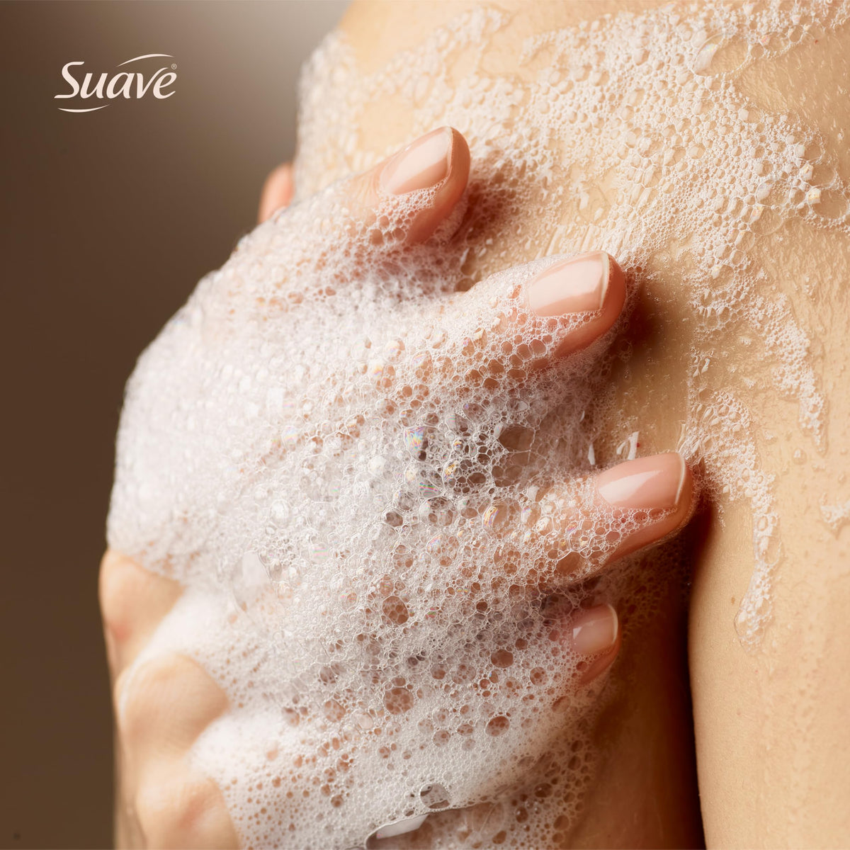 Close-up of Suave foam texture on hand showing rich lather and hydration
