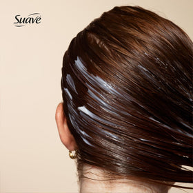 Suave conditioner cream texture showing smoothing, detangling benefit