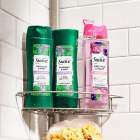 Applying Suave conditioner to wet hair in shower for softer strands