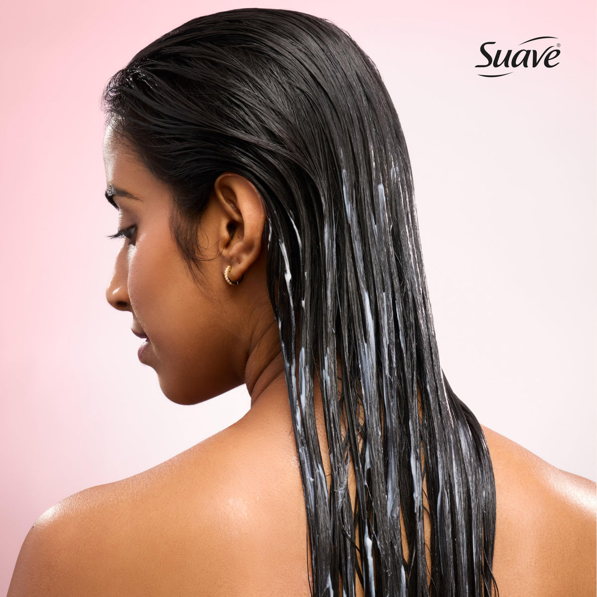 Suave Hydra Gloss bottle beside shampoo in shower for system benefits