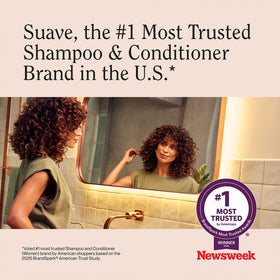 Hand holding both bottles to show Suave bundle size and scale