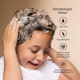 Suave Kids pouring into palm to show one step head to toe use and quick application