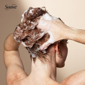 Suave 28 oz bottle beside common items to show full-size scale
