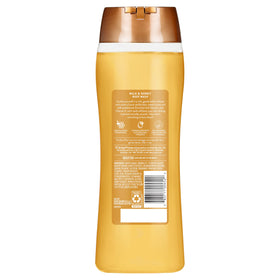 Suave bottle in hand showing 18 oz scale for family-sized value