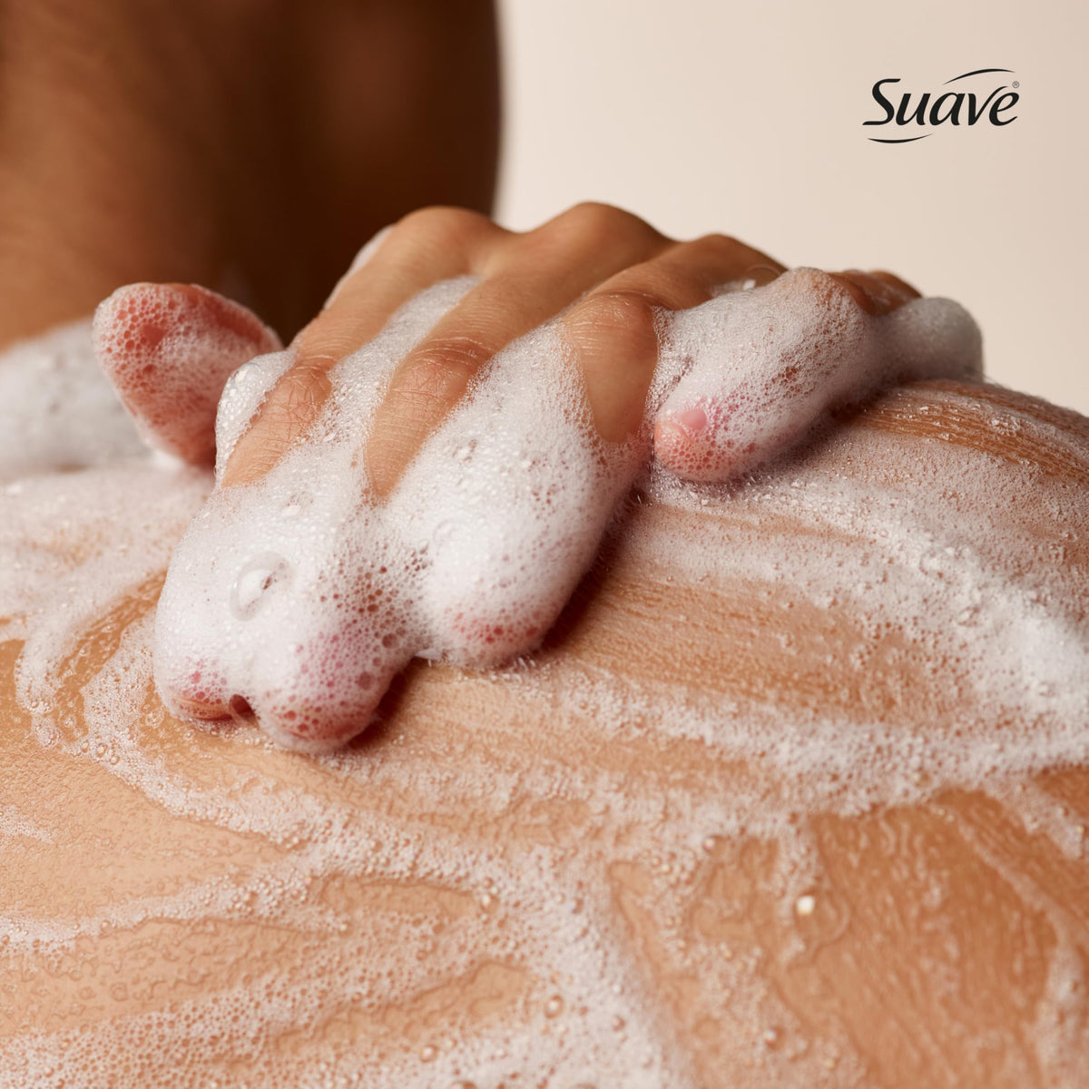 Close-up of Suave creamy foam texture delivering gentle, hydrating cleanse