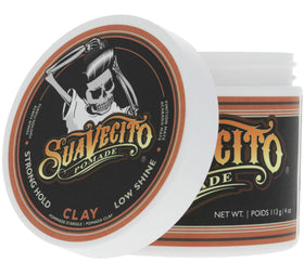 Suavecito in barber chair styling client for textured, natural-looking hold
