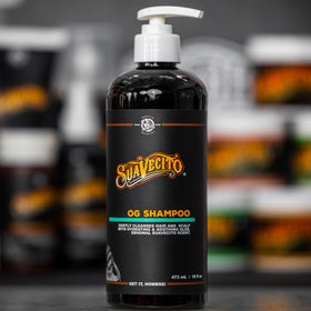 Suavecito next to common items showing 16 oz size and travel readiness