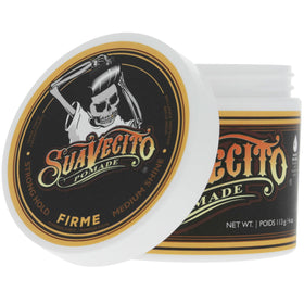 Hand holding Suavecito jar to show 4 oz scale and travel convenience