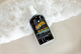 Male model using Suavecito spray to create tousled beachy volume