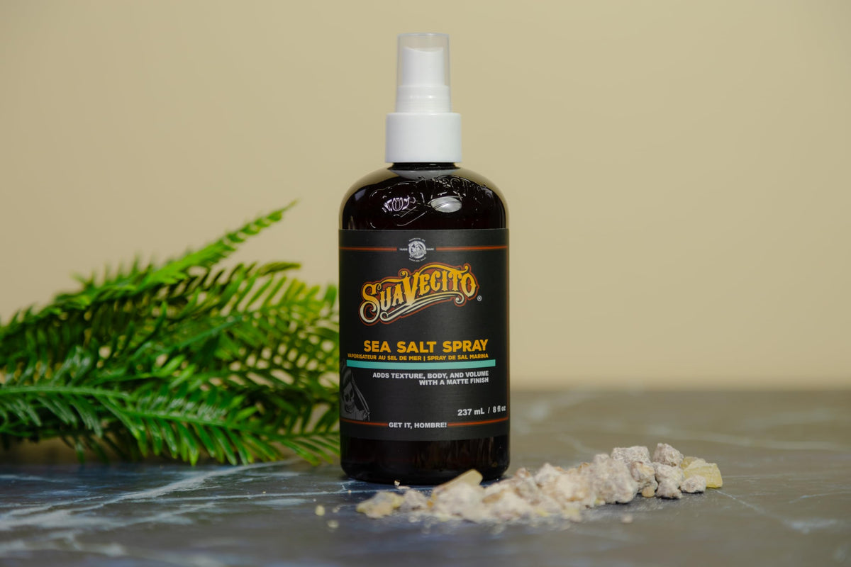 Suavecito 8 oz bottle next to common items to show true size