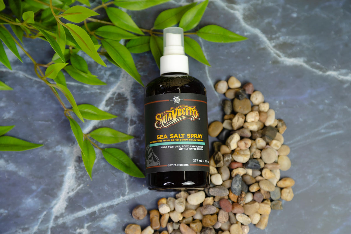 Suavecito spray on hands showing lightweight texture and spreadability
