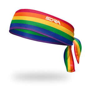 Suddora rainbow tie headband front view showing vibrant stripes and coverage benefit