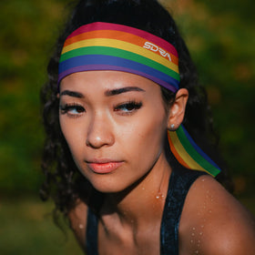 Suddora headband worn at Pride parade offering colorful style and sweat control