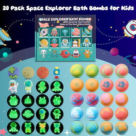 SudsyRoar revealed astronaut and rocket toys beside a popped bath bomb, encourages imaginative play