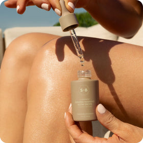 SUGARED + BRONZED on bathroom vanity next to skincare, conveys routine integration