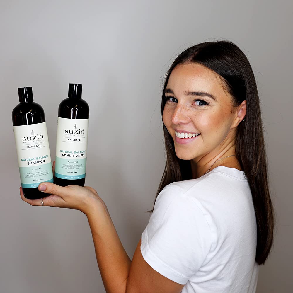 Sukin shampoo lathering in shower, demonstrating gentle cleansing action