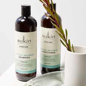 Sukin shampoo creamy texture on hand, showing moisturizing baobab oil effect