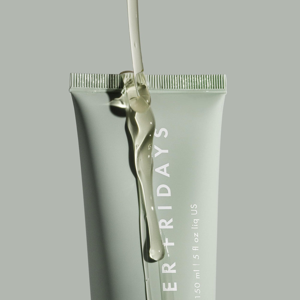 Summer Fridays bottle with dispenser mid-pump showing easy application and control