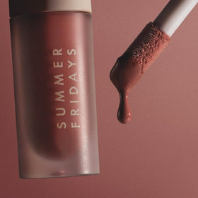 Summer Fridays held in hand to show compact 0.15 oz travel-friendly size