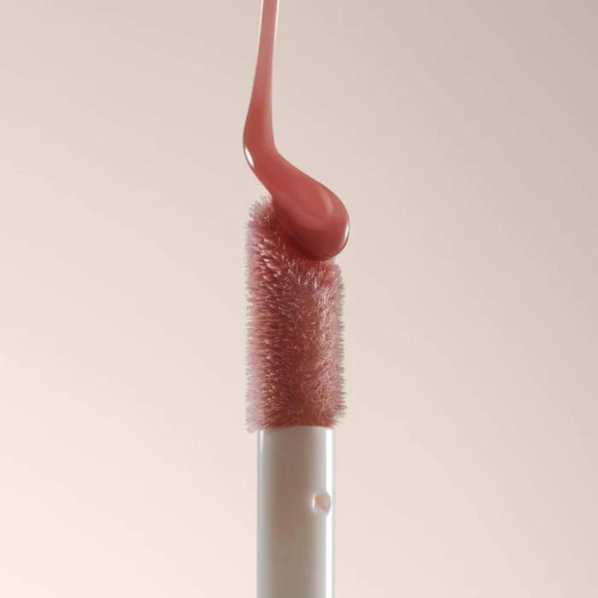 Summer Fridays lip oil flatlay with skincare, boosts shine and layers well