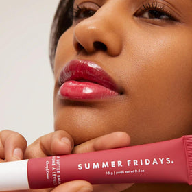 Summer Fridays application on lips demonstrating sheer cherry color and shine