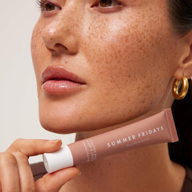 Summer Fridays placed in a handbag scene for everyday touch-up convenience