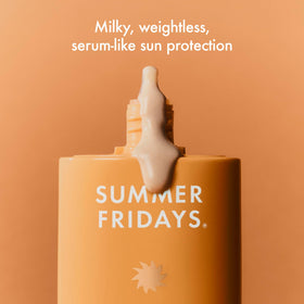 Summer Fridays pump dispensing milky sunscreen demonstrating lightweight texture