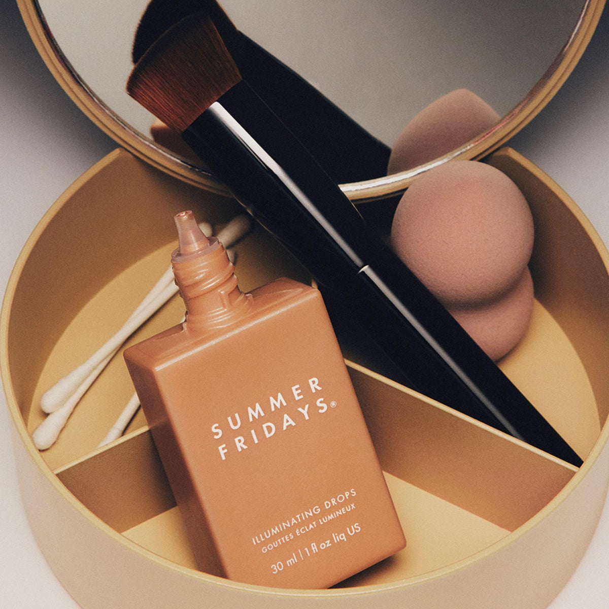 Summer Fridays size comparison next to coin showing compact 1 fl oz