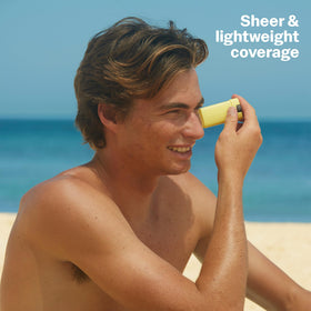 Sun Bum stick applied to nose and cheek for quick targeted coverage