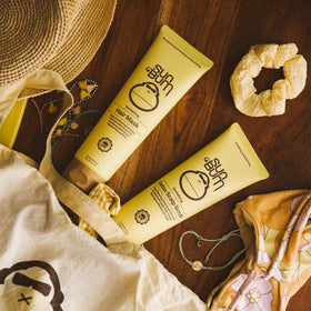 Sun Bum scalp scrub being massaged into wet hair for thorough detox