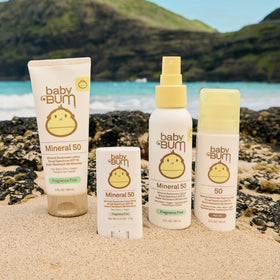 Sun Bum baby lotion being applied to toddler arm illustrating gentle, quick-absorbing benefit