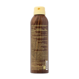 Person using Sun Bum at beach showcasing quick application benefit