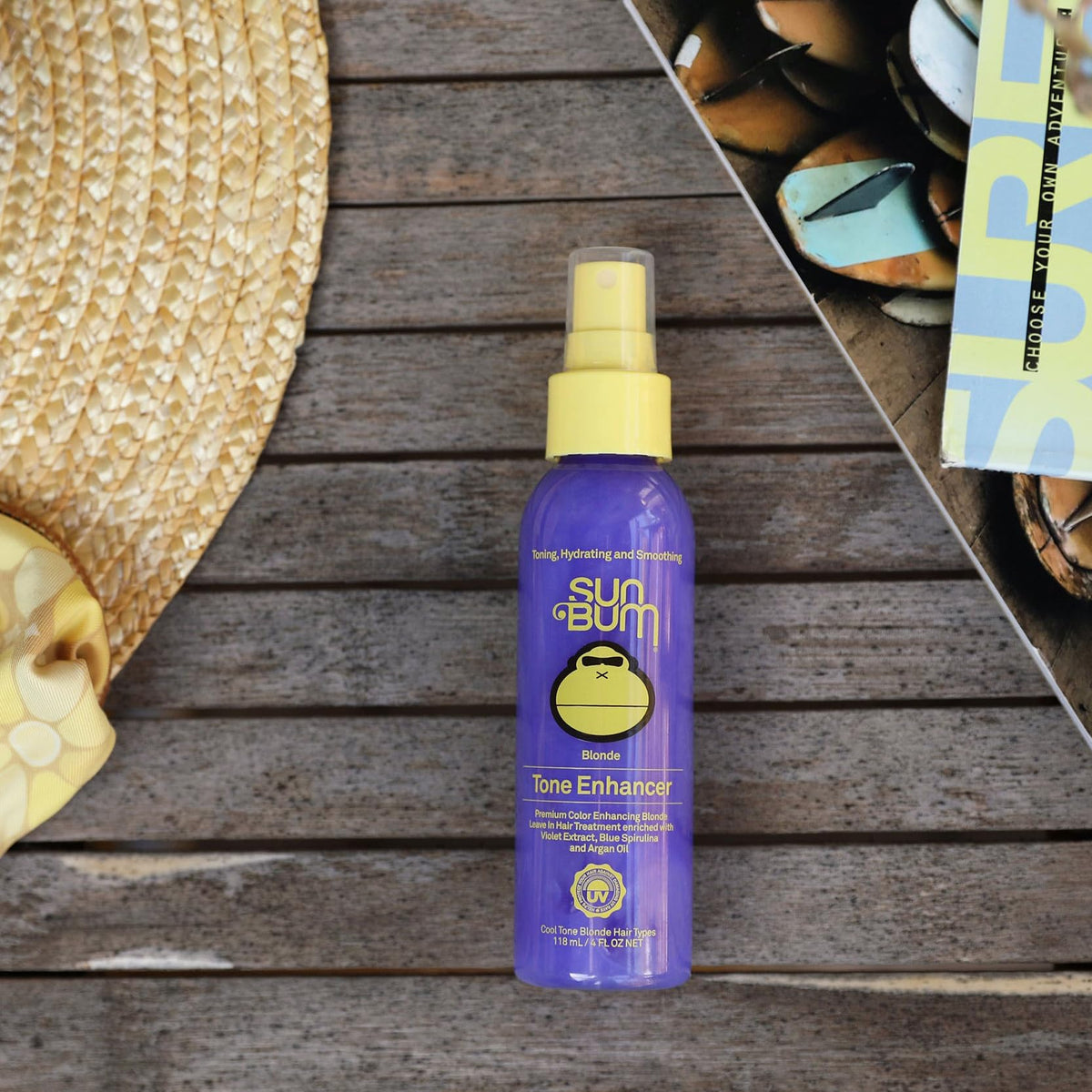 Model spraying Sun Bum toner at the beach for refreshed tone and UV-aware care