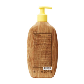 Sun Bum bottle in a beach setting conveying outdoor protection and summer scent